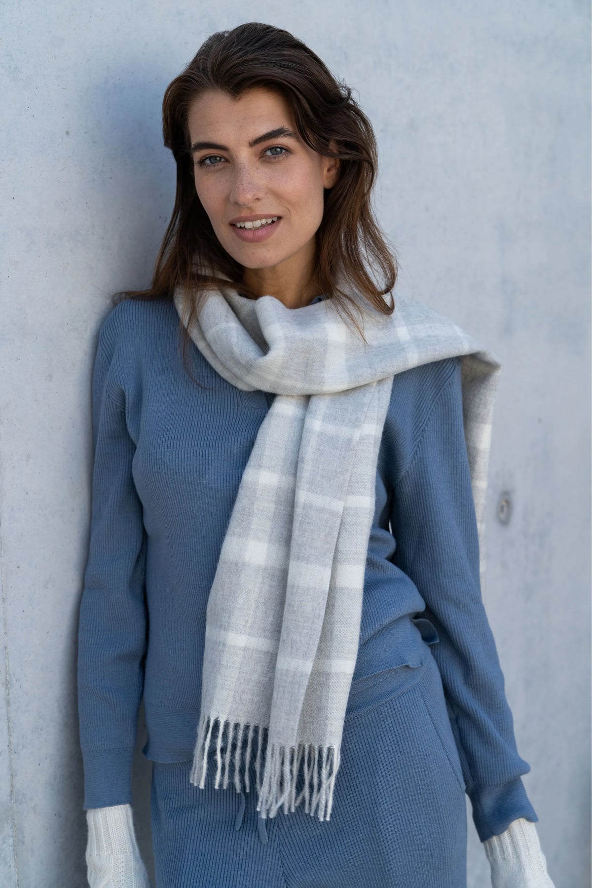 The Alpaca Scarf & Wristwarmer Gift: grey plaid alpaca scarf worn