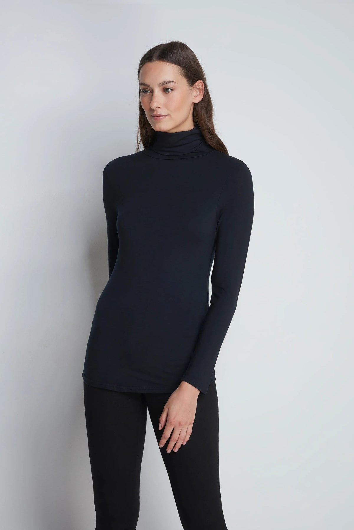 The Roll Neck & Leggings Pairing: black roll neck worn