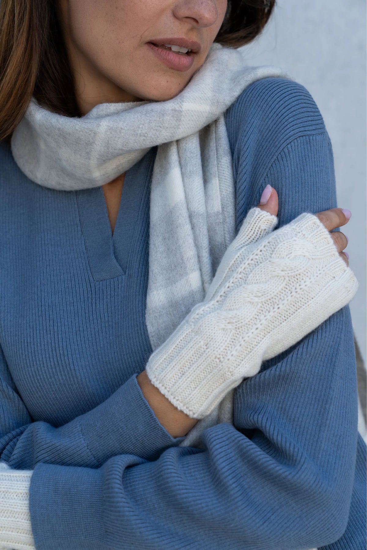 The Alpaca Scarf & Wristwarmer Gift: close-up of the cable-knit alpaca wristwarmer and plaid scarf