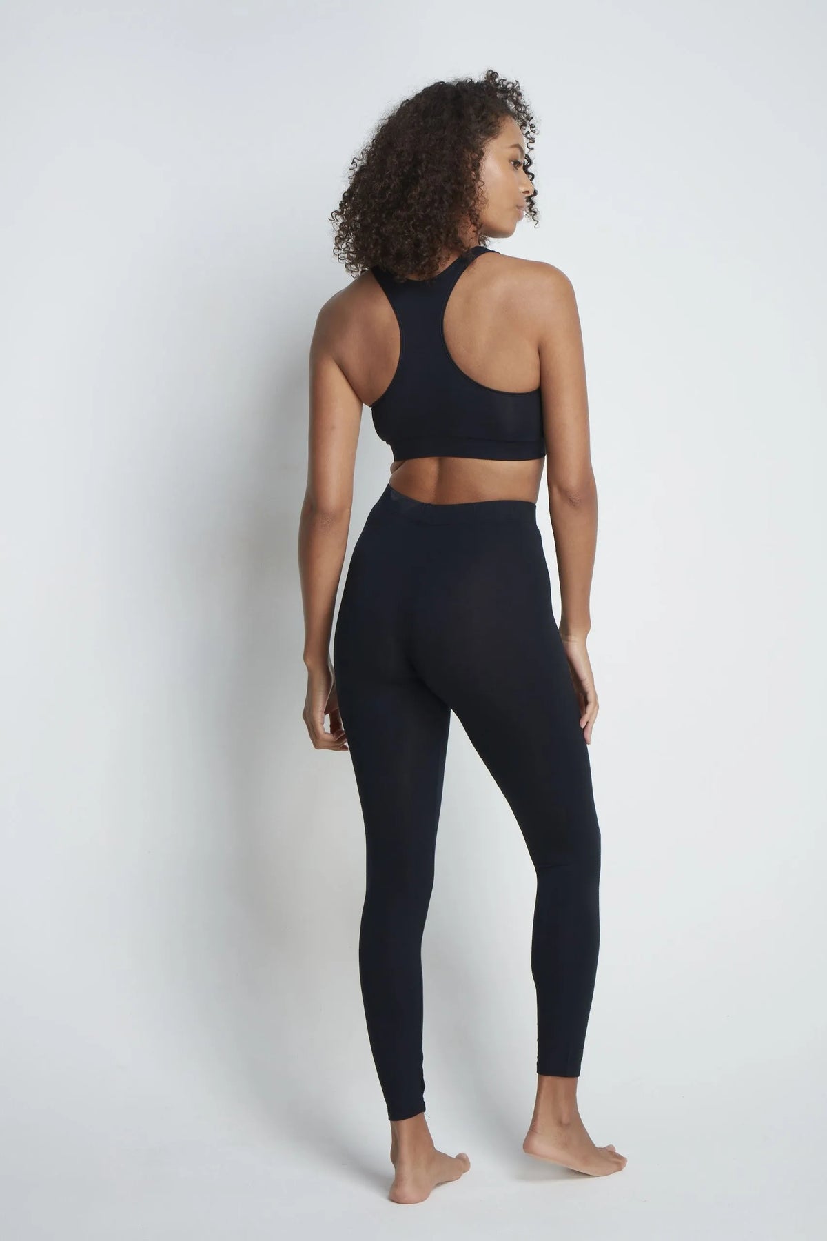 The Roll Neck & Leggings Pairing: black micro modal leggings, back