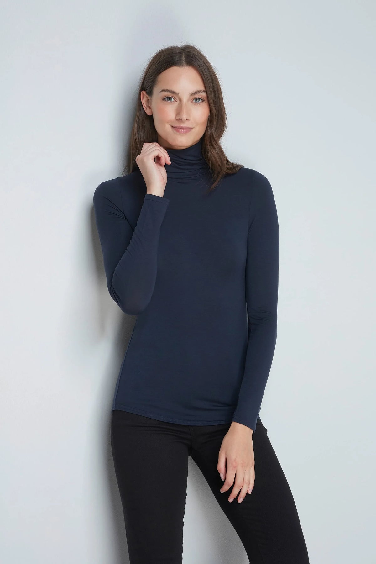 The Roll Neck & Leggings Pairing: navy roll neck worn with black leggings